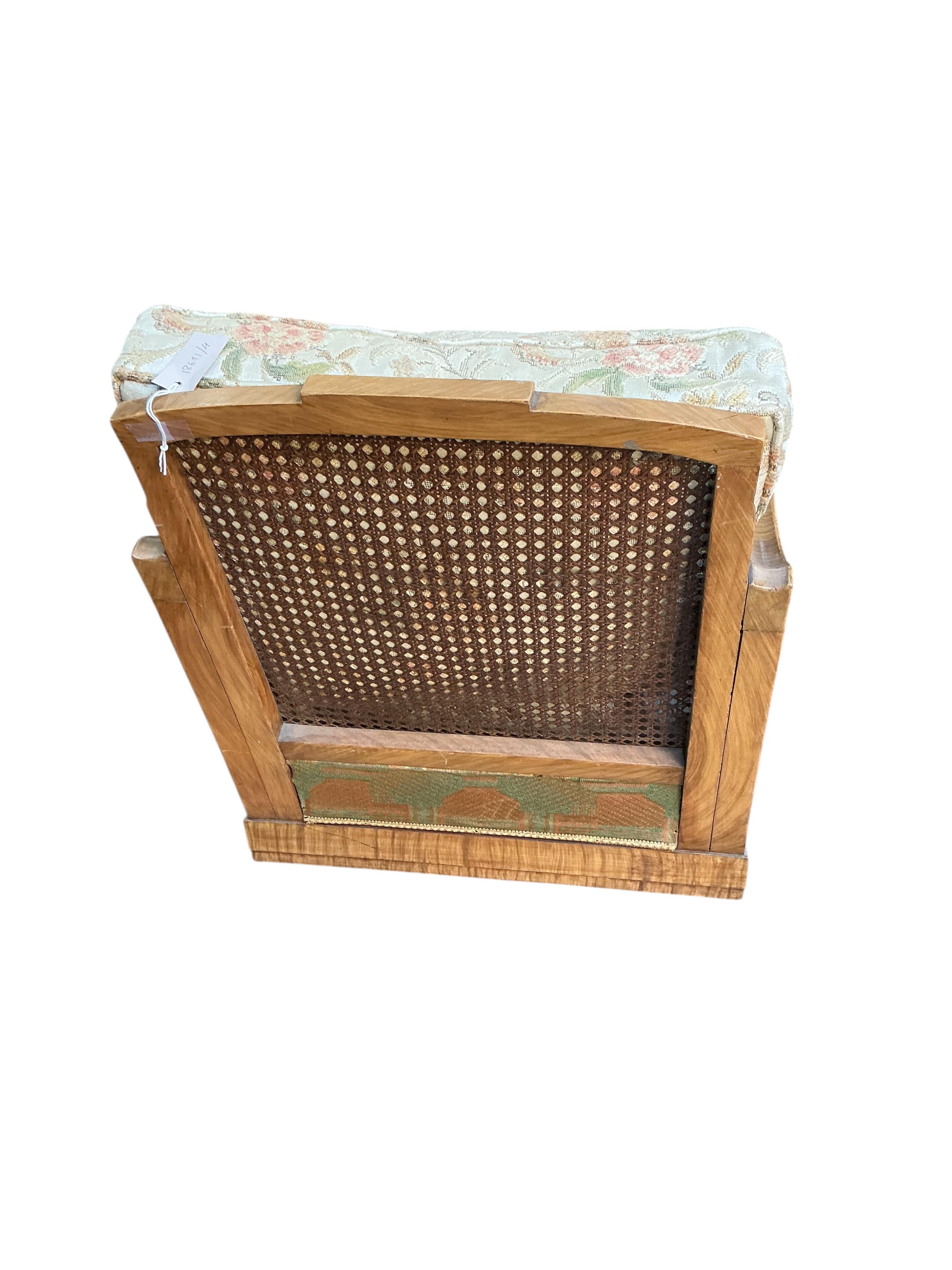 A Maple and Co. Art Deco walnut bergere armchair, width 66cm, depth 90cm, height 73cm